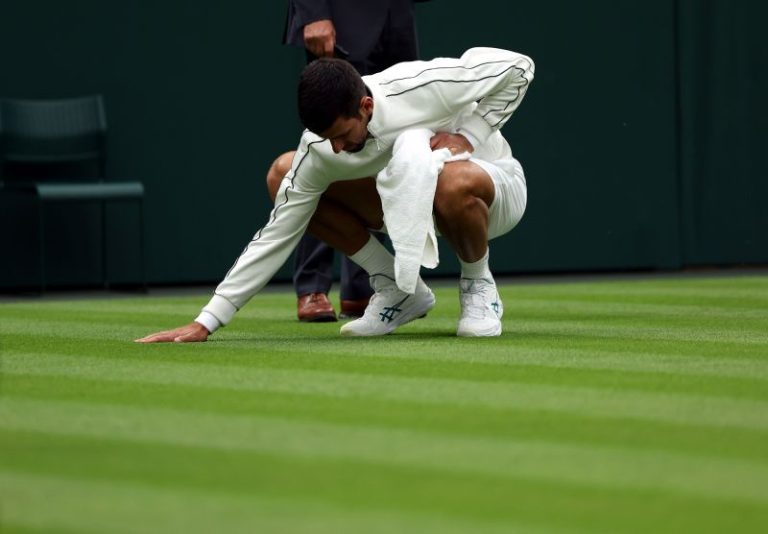 Novak Djokovic takes on grass-drying duties during first-round victory at Wimbledon