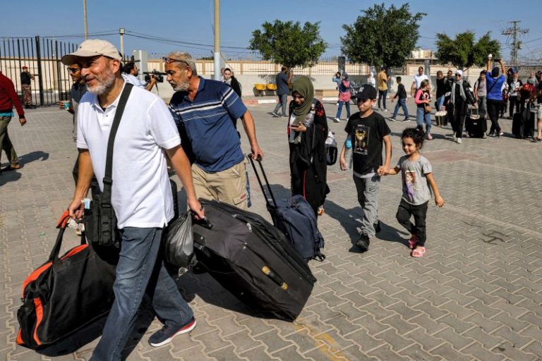 Injured Palestinians cross Gaza border into Egypt, the first allowed out since Israel-Hamas war began